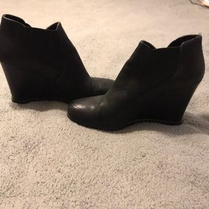 Black leather wedge booties